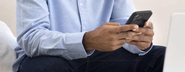 Man uses mobile phone