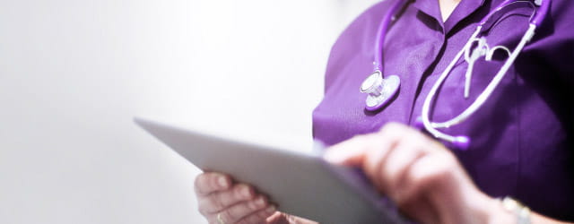 Nurse reviews medical chart